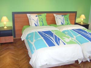 4 person comfort apartment with city view, balcony, an extra bed, and private facilities (bath and shower)